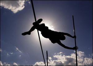 Otsego's Bobby Walker clears the bar - and eclipses the sun - during the recent Springfield Invitational.