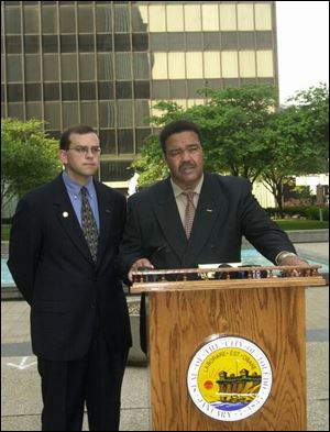 Councilman Wade Kapszukiewicz, left, and Mayor Jack Ford say the proposal will help keep jobs downtown.