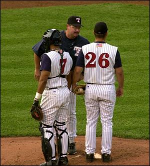 Hens pitching coach Britt Burns has a few words for pitcher Shane Loux, who shut out Scranton for 10 innings last night.