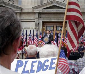 Gov. Bob Taft calls on the U.S. Supreme Court or U.S. judges to overturn a federal appeals court's ruling - now on hold - to eliminate the words, `under God,' from the pledge.
