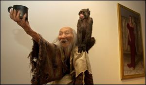 <I>Blind Beggar with Monkey</I>, by Thomas Kuebler, is one of hte works in the Toledo Area Artists exhibition at the Toledo Museum of Art.
