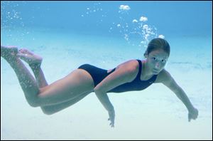 Stephanie Turner floats after a show at Cedar Point, where she has performed for three summers.
