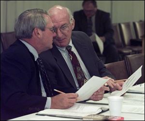 James White, Jr., right, confers with David Boston during a port authority board meeting. Mr. Boston says the chairmanship requires lots of time.