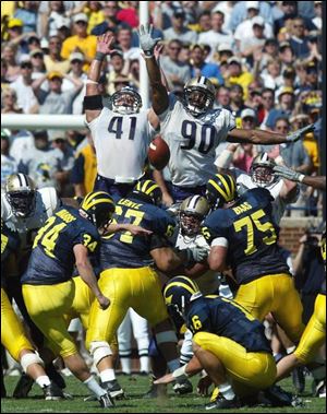 Walk-on placekicker Phillip Brabbs (34) made this winning 44-yard field goal for Michigan, despite missing twice earlier.