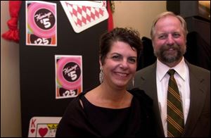 PARTY GOERS: Debbie and Tom Merritt chat at intermission in the grand lobby of the Valentine Theatre. 