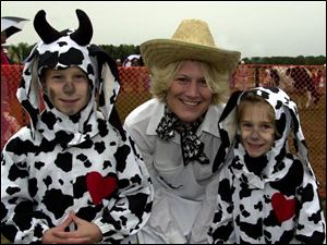 The Gladieux family - Nolan, 8, mom Christine, and Peyton, 6, got in the spirit of the `Cow Moo-neuver.'