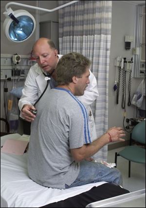 Grants could benefit patients such as Ronnie Rosson, being treated by Dan Gramlich at Monroe Mercy Memorial Hospital, without health insurance.
