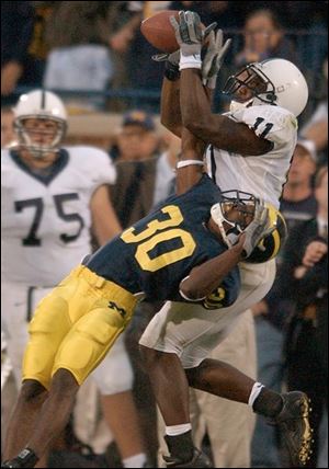 Michigan cornerback Markus Curry (30) breaks up a critical third-down pass attempt to Tony Johnson in the fourth quarter.