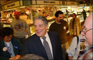 A smiling Tim Hagan, Democratic candidate for Ohio governor, campaigns in Cleveland's West Side market in his uphill battle to unseat GOP incumbent Bob Taft.