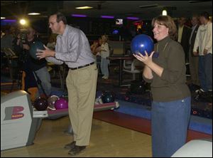 Gov. Bob Taft and Lucas County Commission candidate Maggie Thurber line up shots at Toledo's Imperial Lanes.