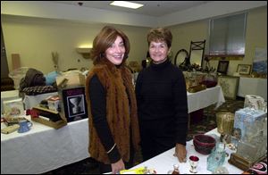 THE BLADE/DON SIMMONS
UPSCALE SALE: Phyllis Deaton and Connie Hallett are two of the leaders of the garage sale of above-average items.