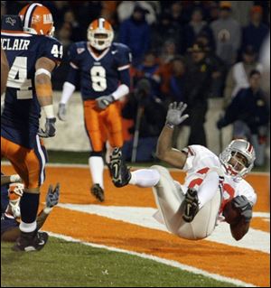 Ohio State's Maurice Hall lands in the end zone for what proved to be the game-winning touchdown in overtime. Illinois had a chance to tie, but Ohio State's defense held the Illini on downs.