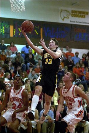Northview's Adam Hirschfeld drives the lane against Southview's Mike Norris (24) and Eric Savory.