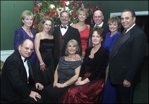 DINNER-DANCE: The ‘Walking in a Winter Wonderland' dance committee at Heatherdowns Country Club included: Sitting from left, Larry Tomczak, Laura White, and Cindy Licata. Standing, Penny Trombley, Pati Andray, Norm White, Julie Hayes, Bill and Sharon Streicher, and Joe Licata.
