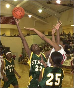 Start's Vicki Brown (22) tries to grab a rebound from Central's Joan Brooks. Brown led Start with 13 points and Brooks pulled down 10 rebounds for Central.