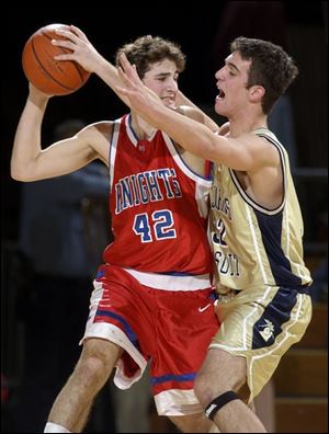 St. John's John Kanney plays good defense against Luke Barton of St. Francis, and does some talking as well.