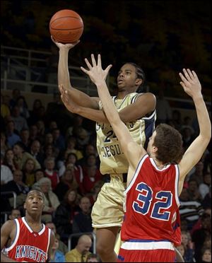 Brandon Barabino of St. John's, who had 13 points and 8 rebounds, shoots over Dustin Szenderski of St. Francis.