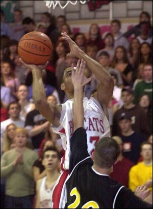 Bowling Green's Chris Hanna ignores Bryan Heidtman's hand as he scores two of his nine points against Northview. The Bobcats grabbed a share of the NLL championship.