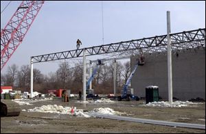 Work has begun on the framework for the laboratory, a tall one-story structure that will be attached to the office building.