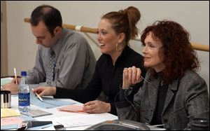 Brandon Knechtel, assistant manager of live entertainment; Nikki Sarrazine, choreographer; and Marje Rody, head of the live entertainment division watch an audition.