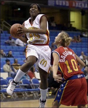 Brandie Hoskins, left, who is headed to Ohio State, drives against Texas Tech recruit Brooke Baughman.