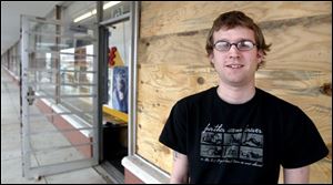 Rob Shaink manages the Allied Record Exchange in the same Secor Road shopping area where Spartan Foods recently closed one of its Food Town supermarkets.