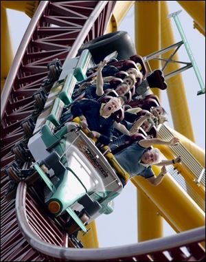 Riders are lifted out of their seats as the Top Thrill Dragster zips into a 270-degree spiral.
