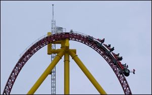 Riders crest a 420-foot-tall hill then plung 90 degrees.