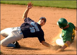 Montpelier second baseman Jose Salazar reaches back in the 10th inning in an attempt to tag Newark Catholic runner Chris Wohlhelter, who scored the winning run.