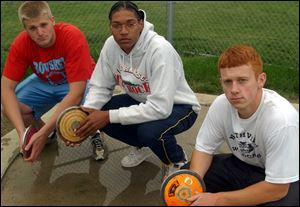 From left, Bowsher's Keith Dankert, Whitmer's Darnell Randolph and Northview's Andrew Nicholas gave Toledo a discus sweep at the regional meet. But what about state?