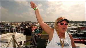 Barb Brown of Bowling Green is excited to be at Michigan International Speedway -- and that was just for yesterday's Winston Cup practice session.