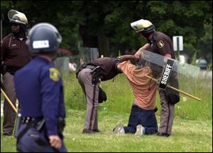 Berrien County sheriff's deputies pat down a man in Benton Harbor because he was walking too slowly through town.