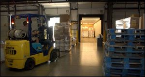 Home Depot merchandise is unloaded at the Monroe County `cross dock' facility, a transfer point that does not include storage.