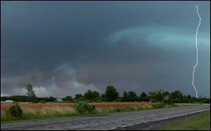Lightning crackles through the darkened afternoon sky at Fallen Timber and Russell roads in Monclova Township.