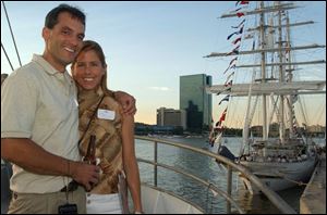 CALEDONIA COUPLE: Rick Swope and Karla Schwanke pose on the Caledonia; Tarangini is in the background.