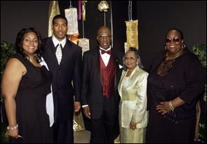 A.S.S.I.S.T. AWARDS: From left, Kara Lawshe, founder Jim Jackson, the Rev. John Roberts and his wife, Bernice, and Ardenia Jones Terry attend banquet in the SeaGate Convention Centre.