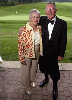 DECKED OUT: John Kretzschmar, with wife, Sue, wears his knickers, or plus fours.
