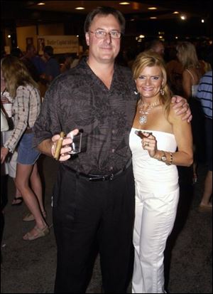 TIME FOR FUN: Jeff Shugarman and Tressy Paquin are among the 2,300 people at the Toledo Club party.