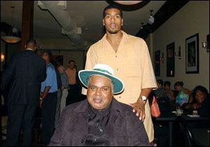 GRAND OPENING: Jim Jackson, with his father, James, opened Jackson's Lounge and Grill Friday night.