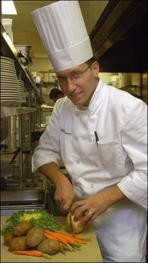 Cheg William Bauman with organic vegetables. 