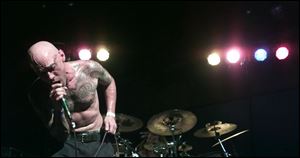 Headstatic lead singer MLE performs during the all-day Toledo Music Festival, held yesterday at Headliners.
