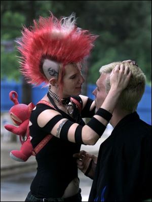 Renee Hicks of Detroit and William Sauer of Toledo were among the 1,500 fans who heard 56 bands perform.