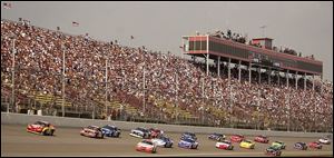 Thousands of fans watched yesterday's Busch Series race, and many more will watch today's Winston Cup race. But NASCAR officials are trying to attract more minorities.