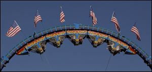 Fair-goers get an upside-down thrill on the Fire Ball Saturday night at the fairgrounds.