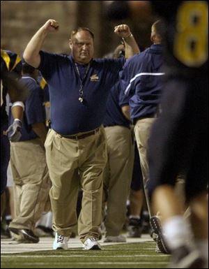 Tom Amstutz, like most of the 31,000-plus fans at last night's game, gets caught up in celebrating the UT win.