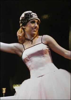 A prayer service was held for Esther Munn, a theater and music major who is shown during a performance.