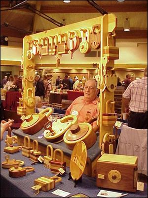 Tim Detweiler of Tipp City, Ohio, displays carved locks.