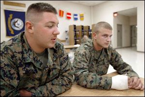 `I appreciate things more,' Cpl. Jeremy Tank, left, with Cpl. Bradley Brettschneider, says at the the Naval and Marine Reserve Center in Perrysburg Township. The two are among the local servicemen who returned recently from duty in Kuwait and Iraq.