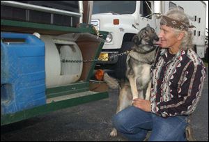Clayton  Tom  Sheperd is greeted warmly by one of his dogs at the Wood County Humane Society in Bowling Green.