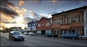 Storefronts along Broadway in the Old South End are done in vibrant colors reflecting the district s Hispanic culture.